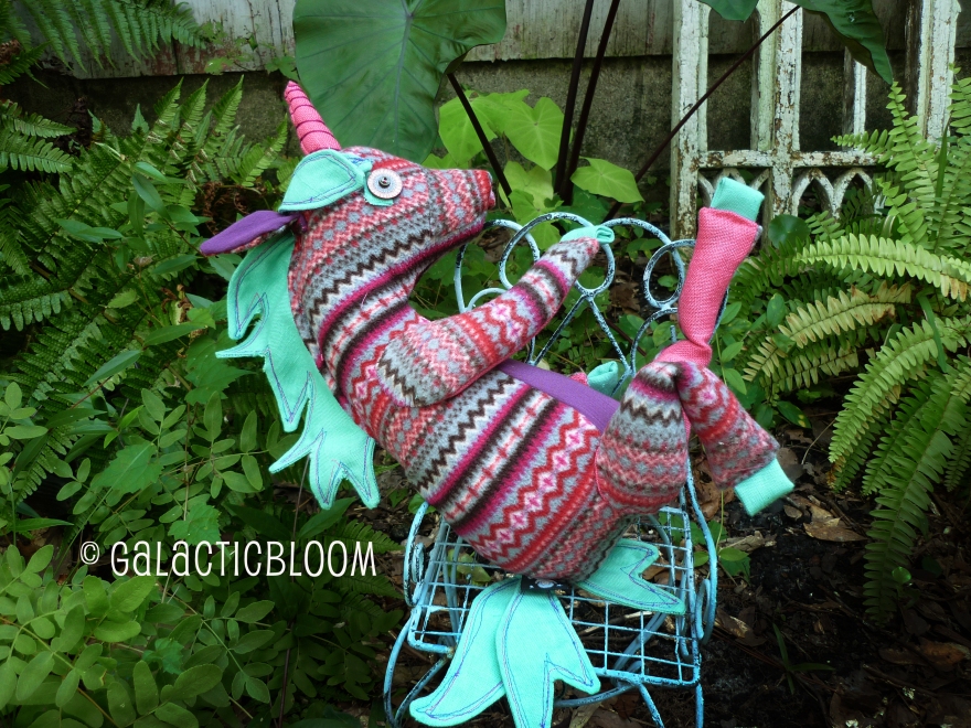 sassy pink purple and teal unicorn posing in the fern garden